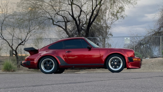 Gloss Vampire Red Inozetek-wrapped Porsche 911 Turbo, photographed outdoors in Arizona.