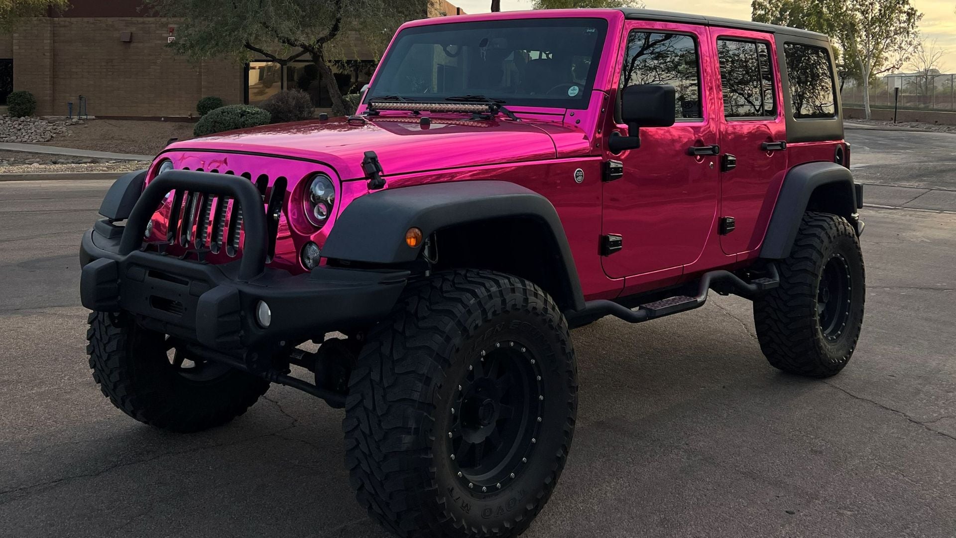Pink chrome Jeep Wrangler wrap with paint protection film in Tempe, Arizona