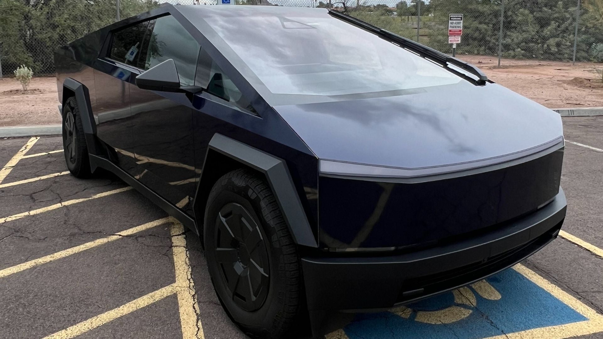 Tesla Cybertruck fully wrapped in KPMF gloss blue-black iridescent vinyl