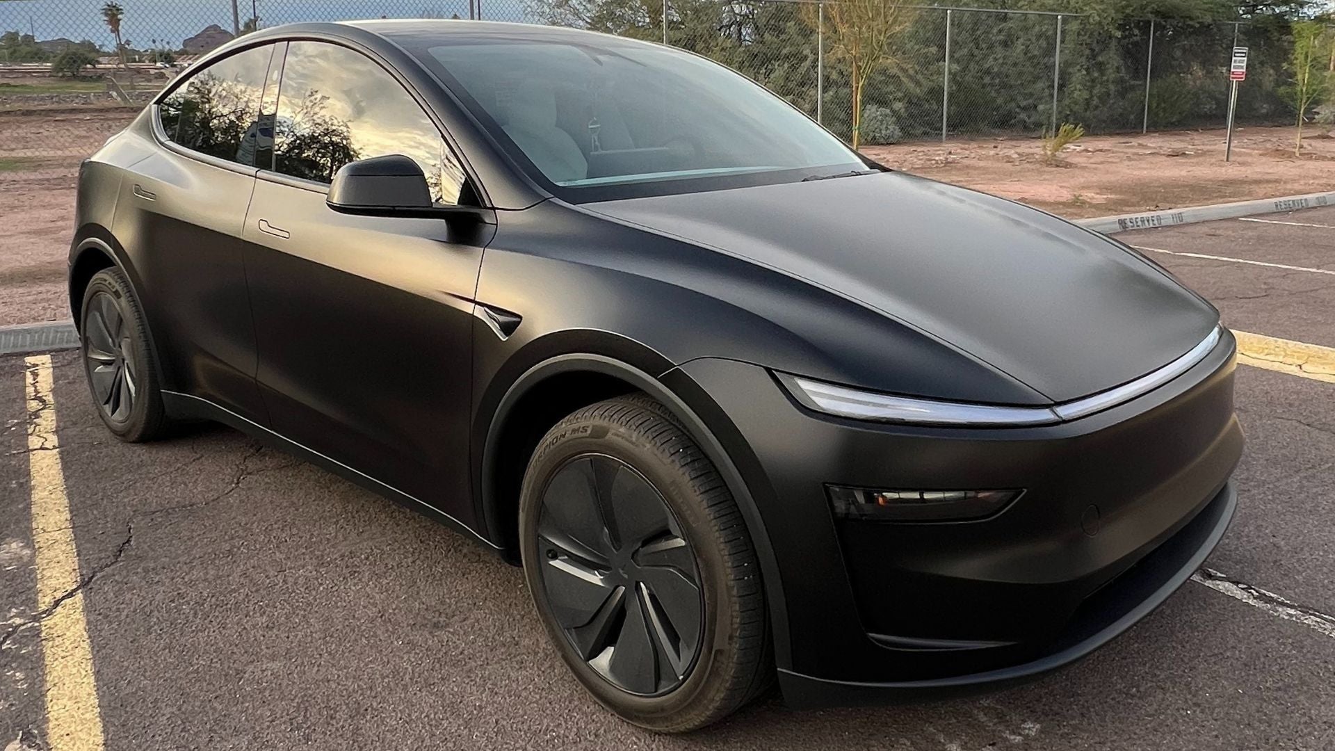 Satin black Tesla Model Y color-change wrap with ceramic coating done at Innovated Wraps in Tempe, Arizona