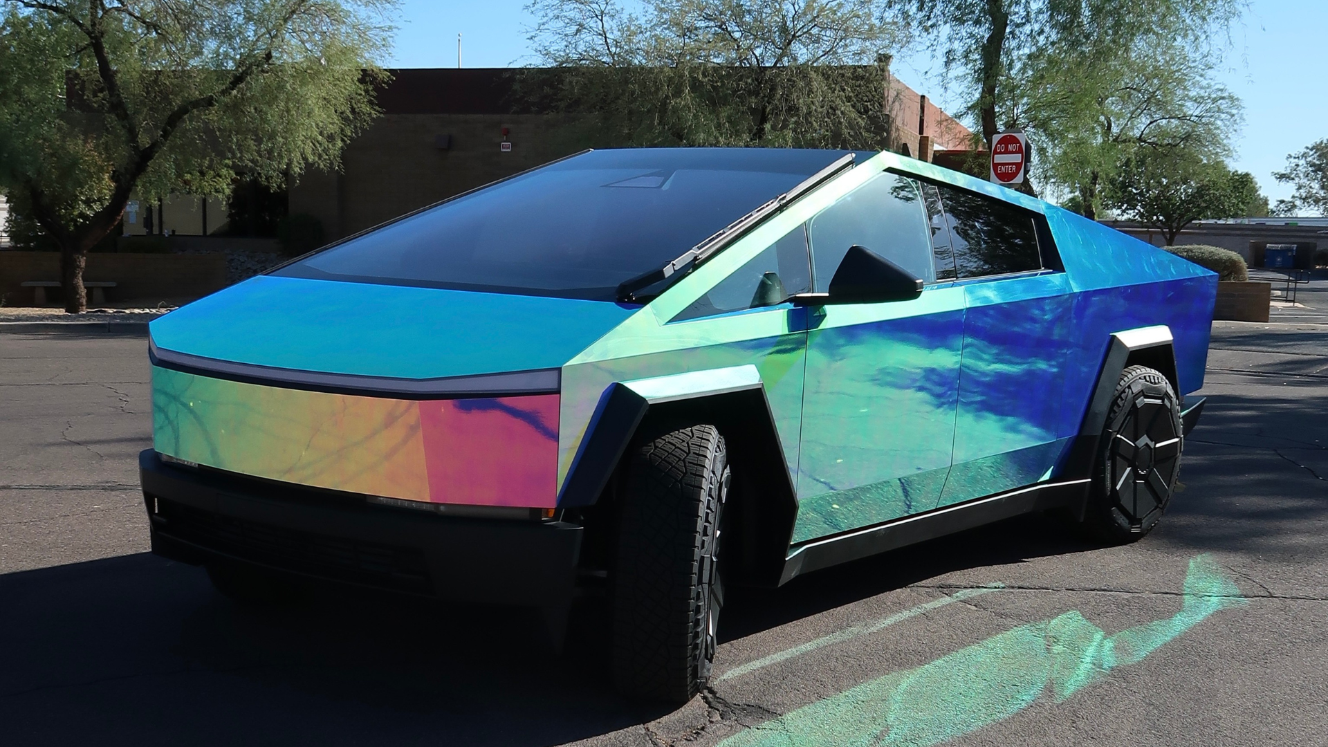 Tesla Cybertruck wrapped in Frozen Berry Chrome vinyl with full-body paint protection film (PPF)