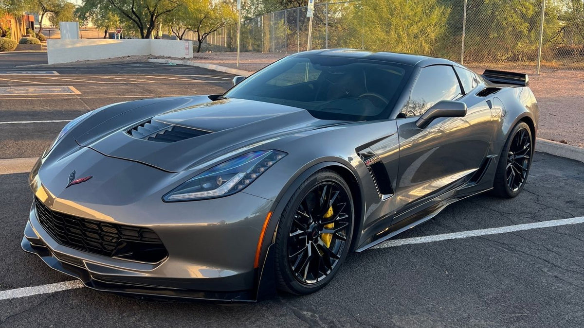 Charcoal gray Corvette with full front PPF parked outside