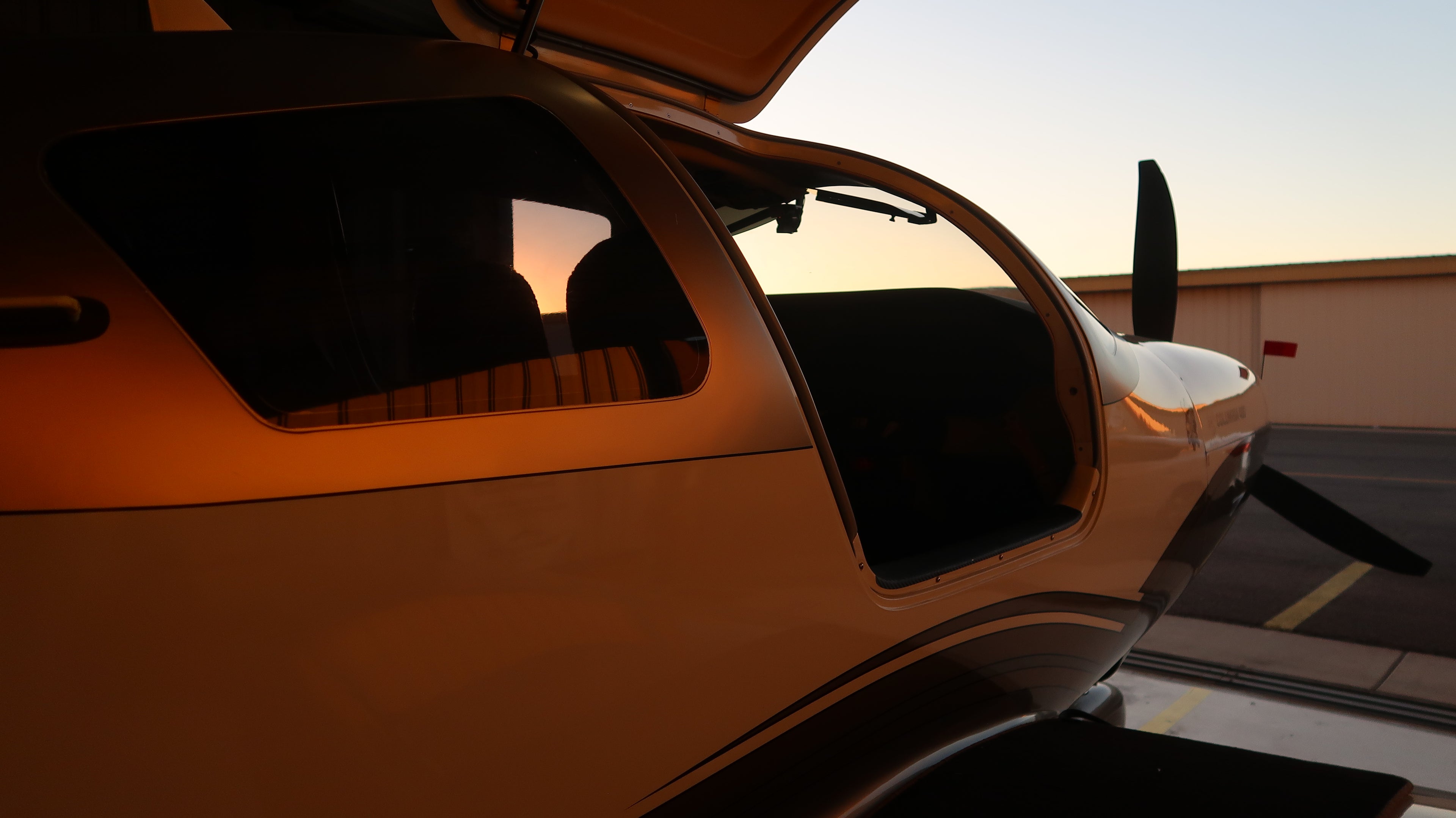 Partial vinyl wrap with pinstripe on a white airplane in Mesa, Arizona