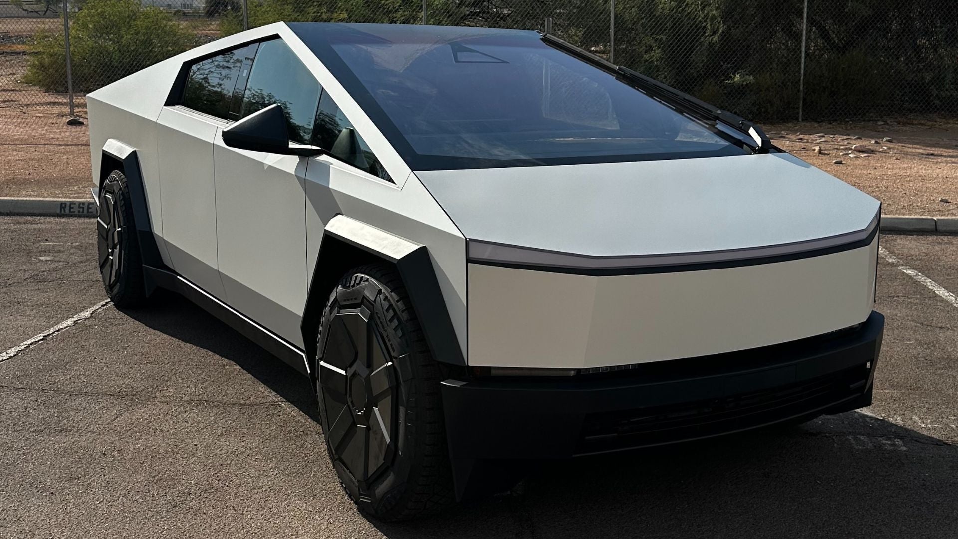 White vinyl wrap transformation on a Tesla Cybertruck in Tempe, Arizona
